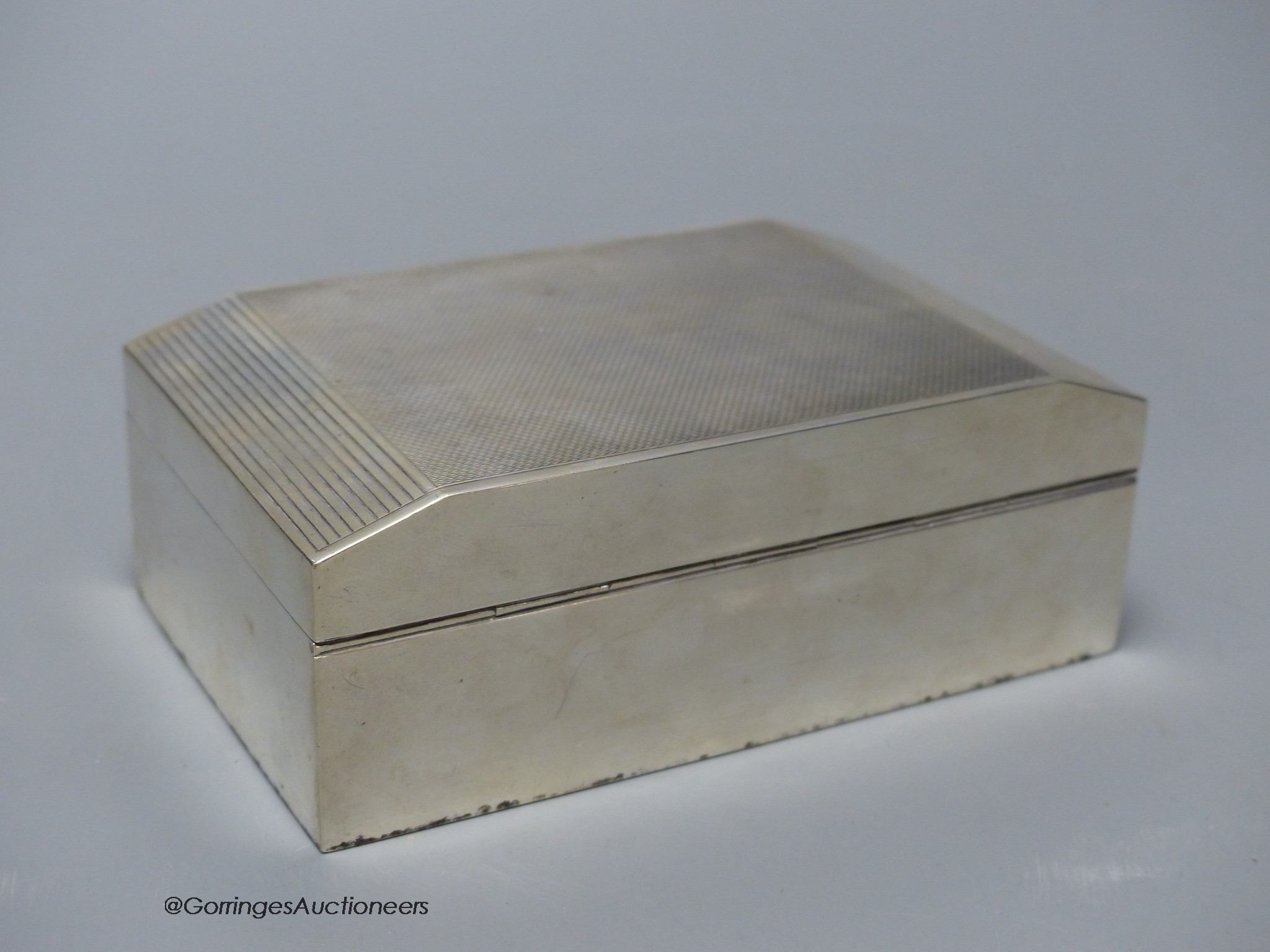 A George VI silver cigarette box, with military related inscription, Birmingham, 1939, 13.7cm, gross weight 14oz.